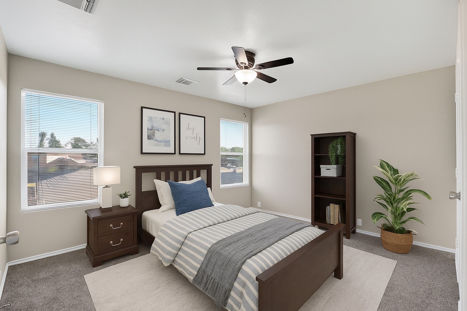 2814 Legends Crest Drive Spring, TX 77386 - Photo 16 of 34 a bedroom with a large bed and a chandelier