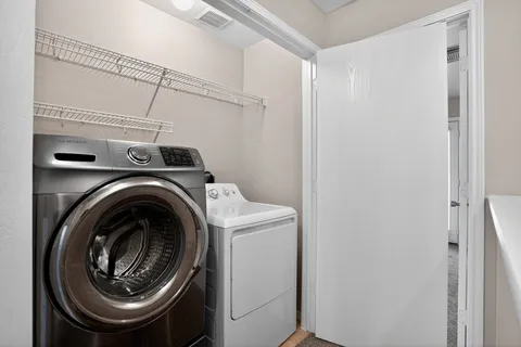a utility room with dryer and washer