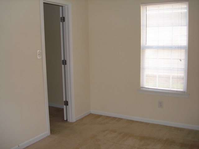421 Bob White Road Macon, GA 31216 - Photo 13 of 23 an empty room with windows and closet