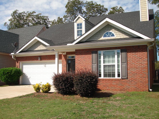 421 Bob White Road Macon, GA 31216 - Photo 22 of 23 a front view of a house with a yard and garage