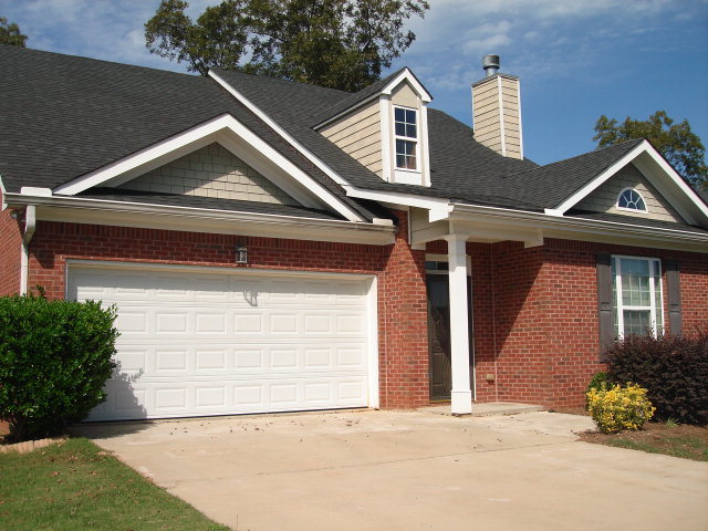 421 Bob White Road Macon, GA 31216 - Photo 23 of 23 a front view of a house with a yard and garage