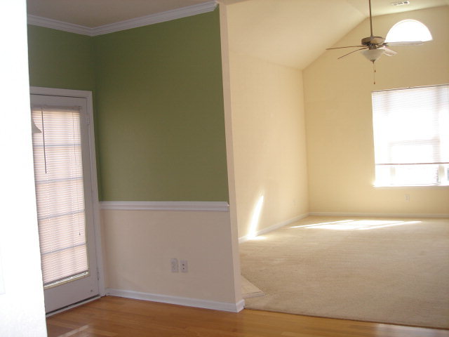 421 Bob White Road Macon, GA 31216 - Photo 6 of 23 a view of empty room with a window and wooden floor