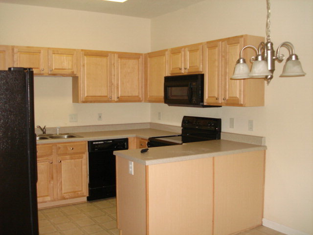 421 Bob White Road Macon, GA 31216 - Photo 8 of 23 a kitchen with stainless steel appliances a stove microwave and refrigerator