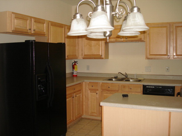 421 Bob White Road Macon, GA 31216 - Photo 9 of 23 a kitchen with a sink and cabinets
