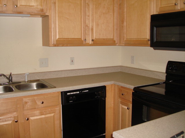 421 Bob White Road Macon, GA 31216 - Photo 10 of 23 a kitchen with a sink and cabinets