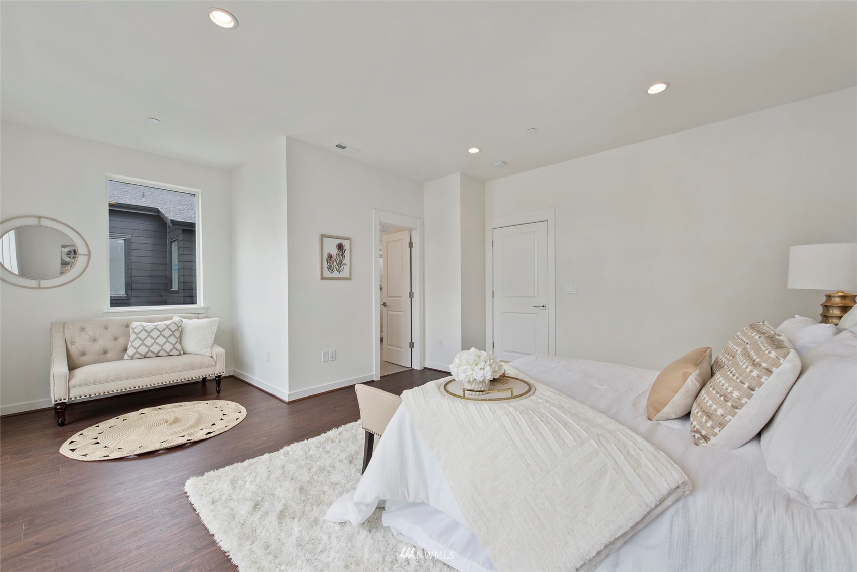 21921 25th Avenue Southeast, Unit A Bothell, WA 98021 - Photo 13 of 25 a bedroom with furniture and a wooden floor
