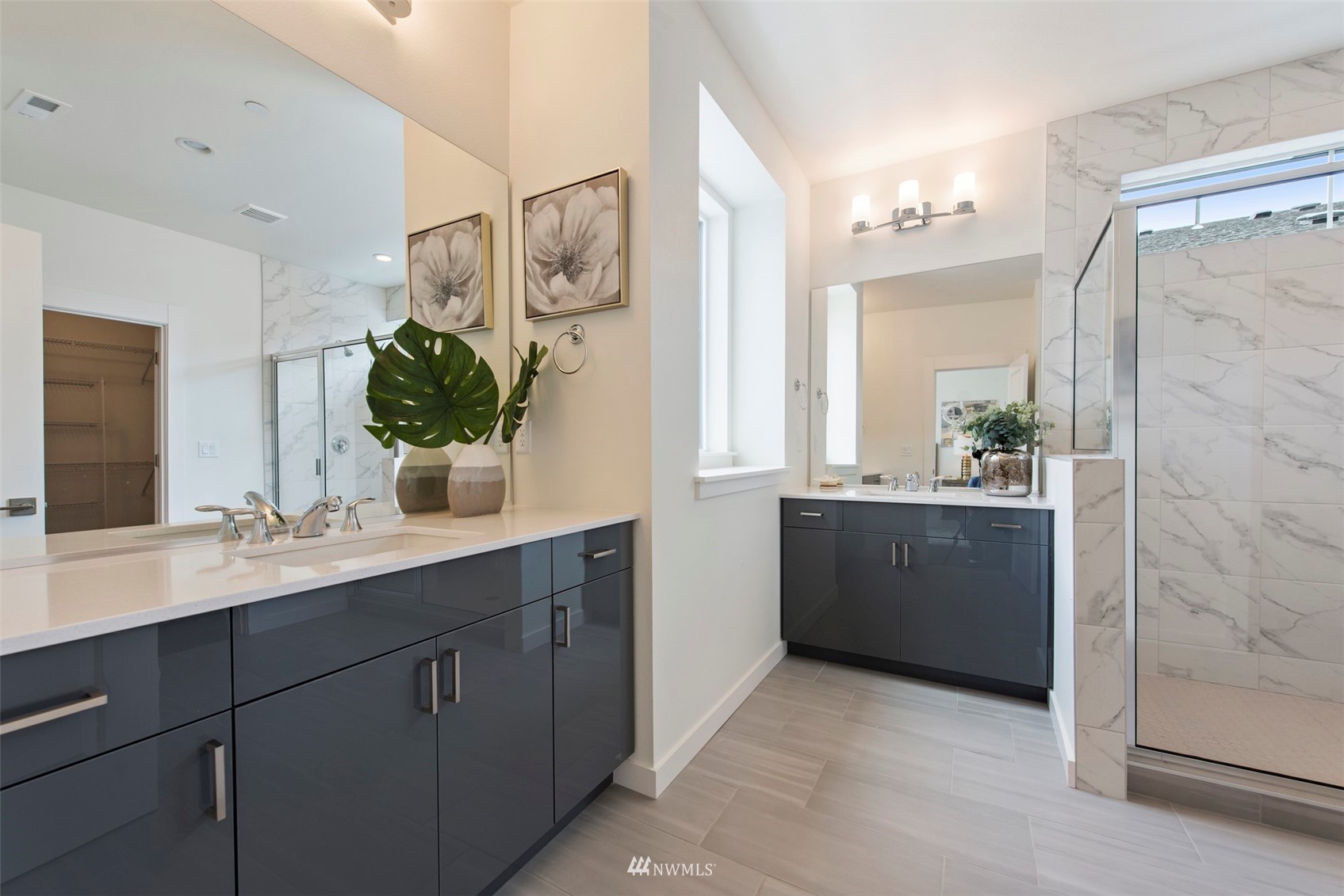 21921 25th Avenue Southeast, Unit A Bothell, WA 98021 - Photo 14 of 25 a bathroom with a double vanity sink and mirror