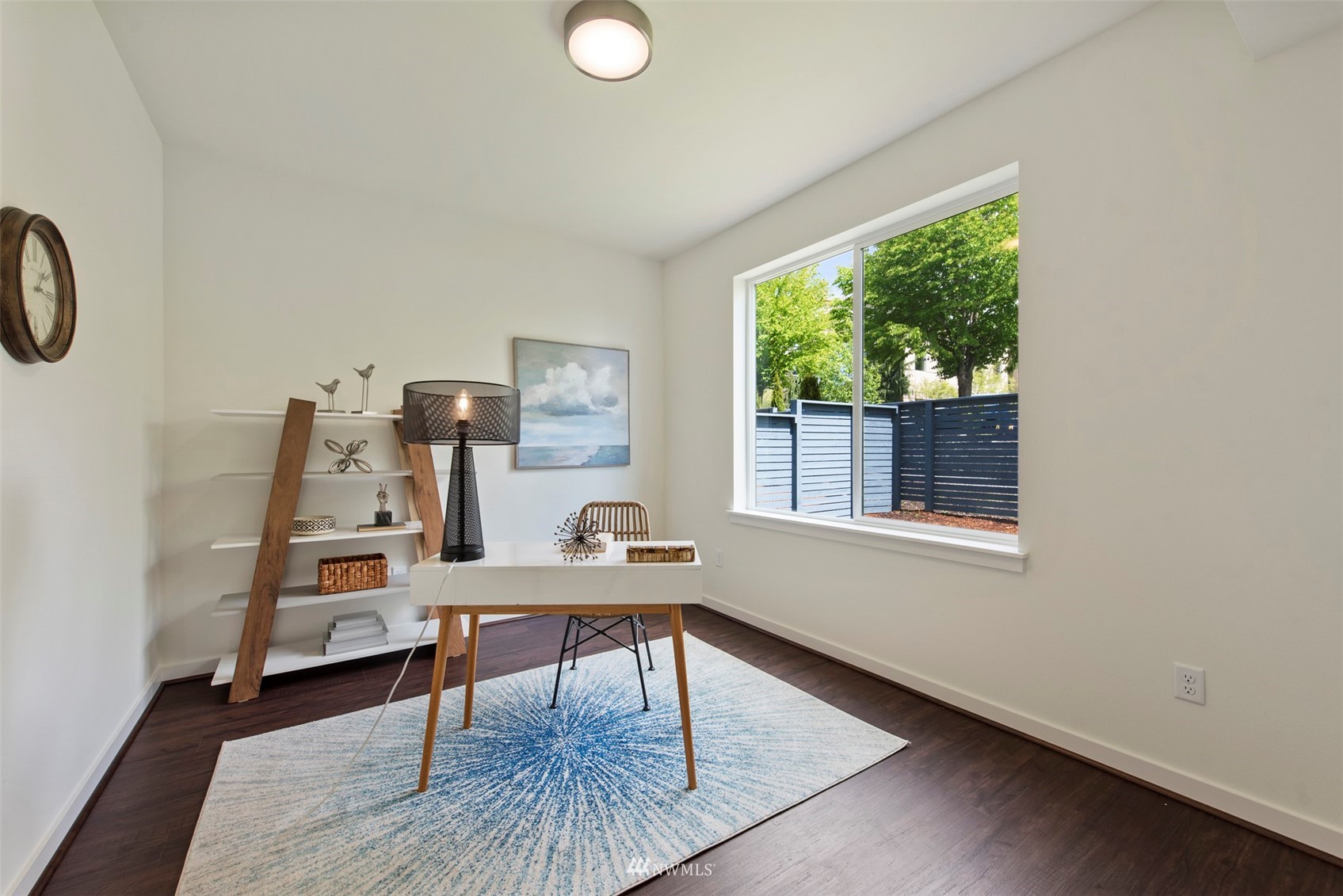 21921 25th Avenue Southeast, Unit A Bothell, WA 98021 - Photo 20 of 25 a view of a workspace with furniture and a window
