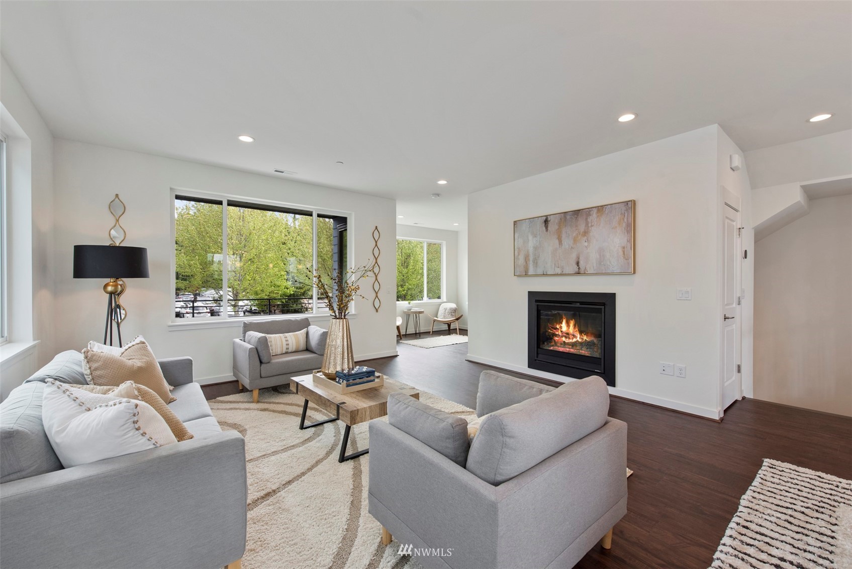 21921 25th Avenue Southeast, Unit A Bothell, WA 98021 - Photo 8 of 25 a living room with furniture fireplace and a large window