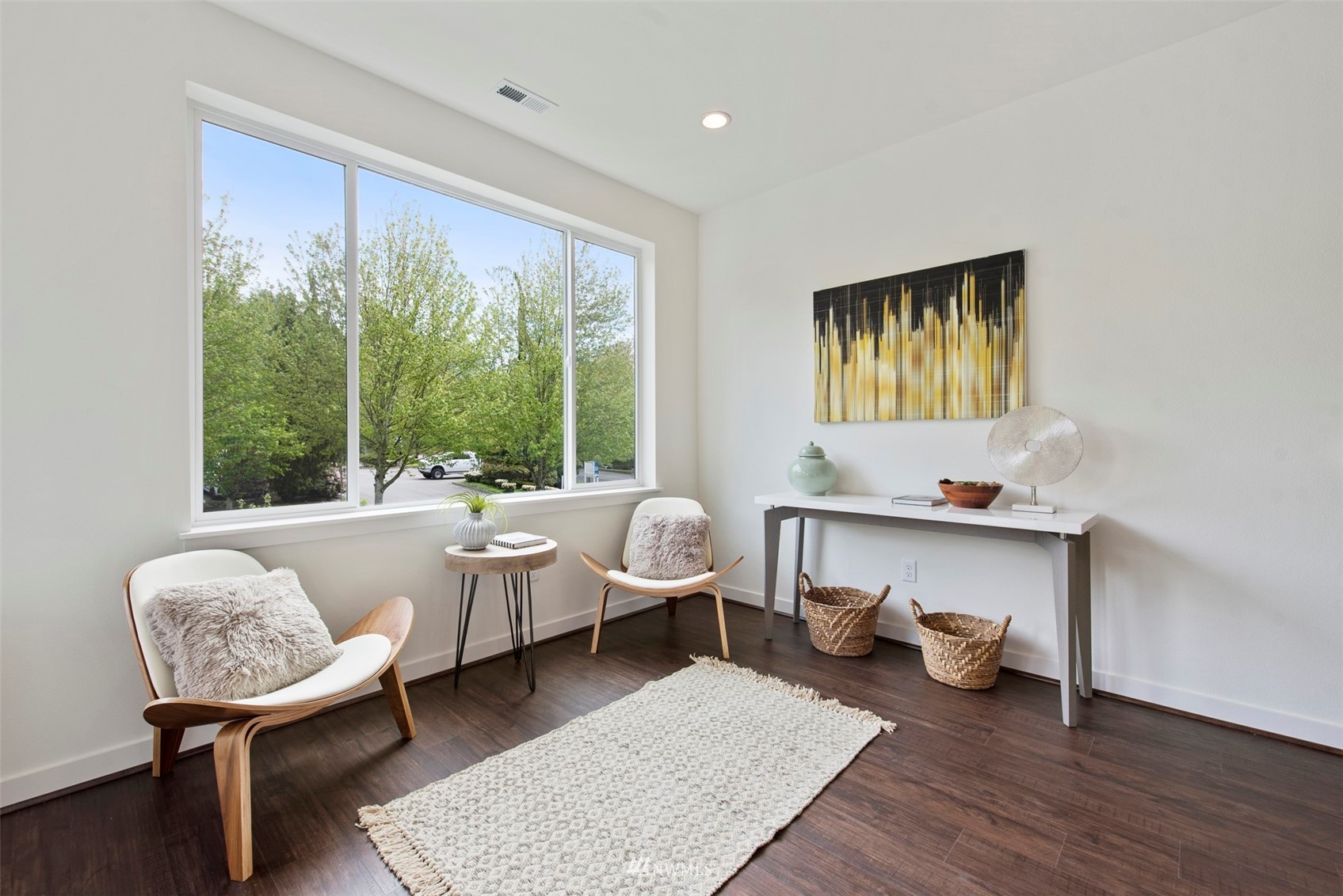 21921 25th Avenue Southeast, Unit A Bothell, WA 98021 - Photo 9 of 25 a living room with furniture and a large window