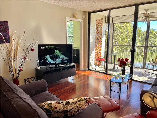a living room with furniture fireplace and flat screen tv