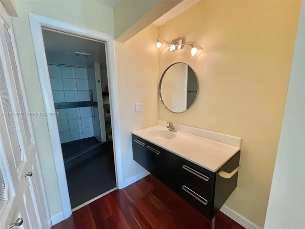 a bathroom with a sink and a mirror