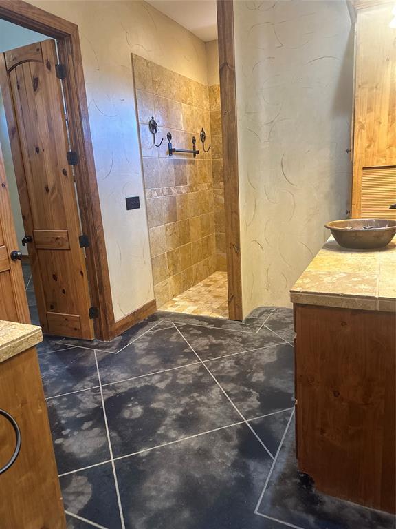 3651 Interstate 30 Frontage Road Sulphur Springs, TX 75482 - Photo 3 of 14 a bathroom with a sink and a shower