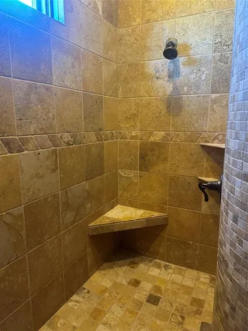 a bathroom with a sink and shower