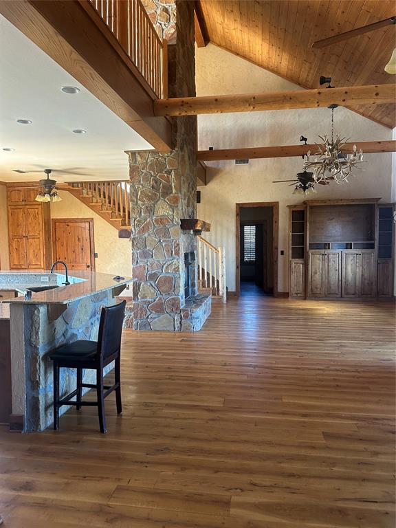3651 Interstate 30 Frontage Road Sulphur Springs, TX 75482 - Photo 7 of 14 a view of a livingroom with furniture wooden floor a flat screen tv and a chandelier