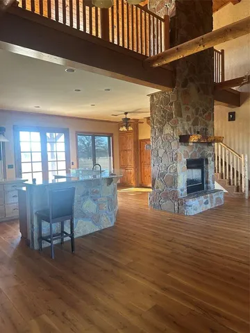 a view of kitchen with furniture and wooden floor