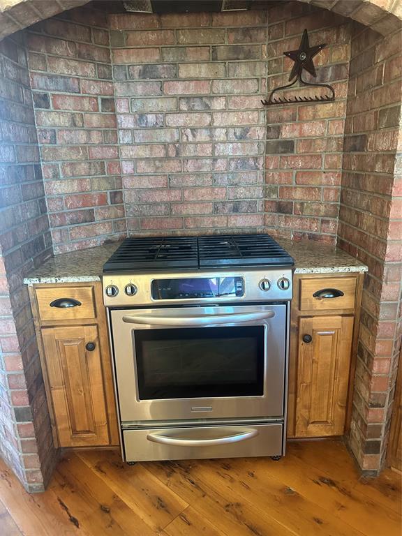 3651 Interstate 30 Frontage Road Sulphur Springs, TX 75482 - Photo 9 of 14 a stove top oven sitting inside of a kitchen