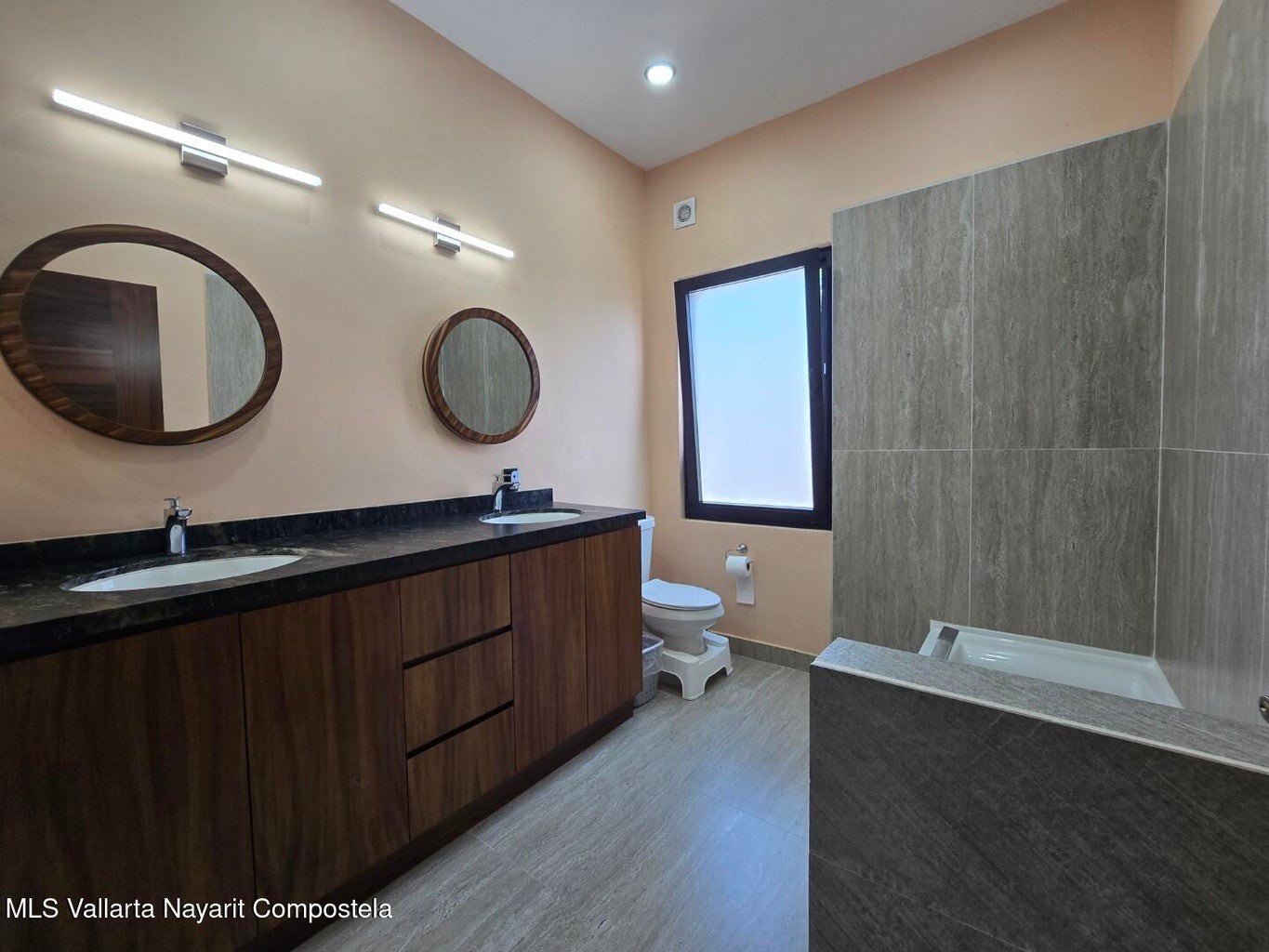 1 Abedul Bell City, MO 63735 - Photo 15 of 38 a bathroom with a double vanity sink and a mirror