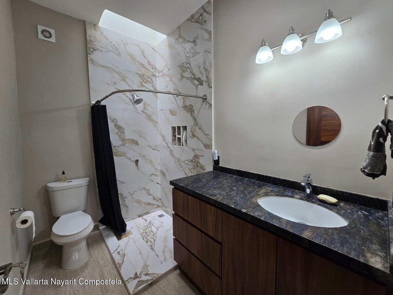 1 Abedul Bell City, MO 63735 - Photo 20 of 38 a bathroom with a granite countertop sink vanity mirror and toilet