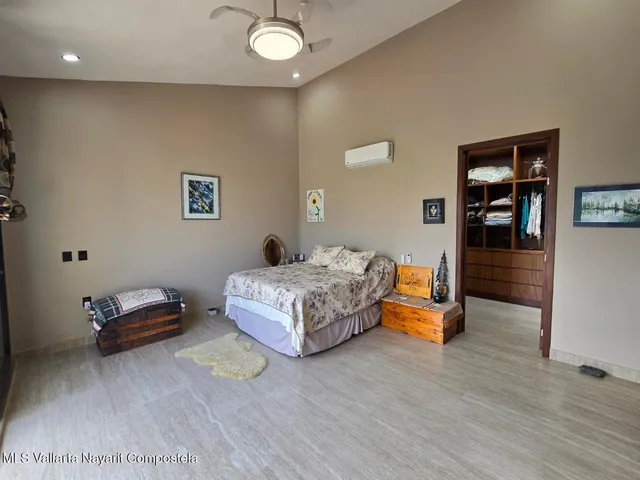 a bedroom with a bed and dresser