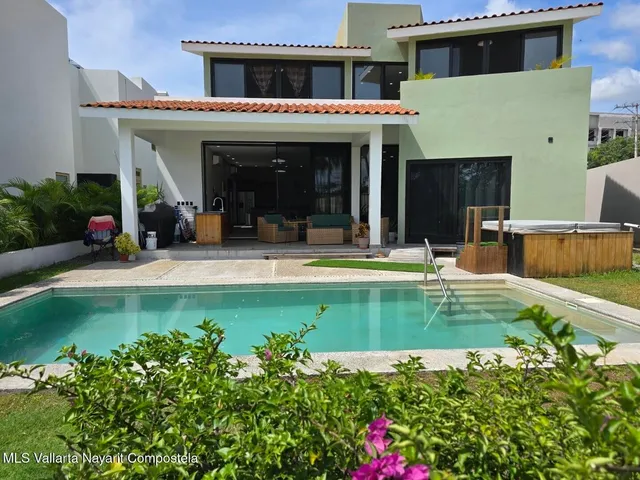 a view of a house with swimming pool