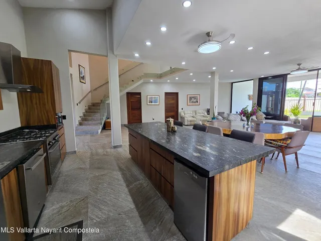 a kitchen with stainless steel appliances granite countertop a stove and a sink