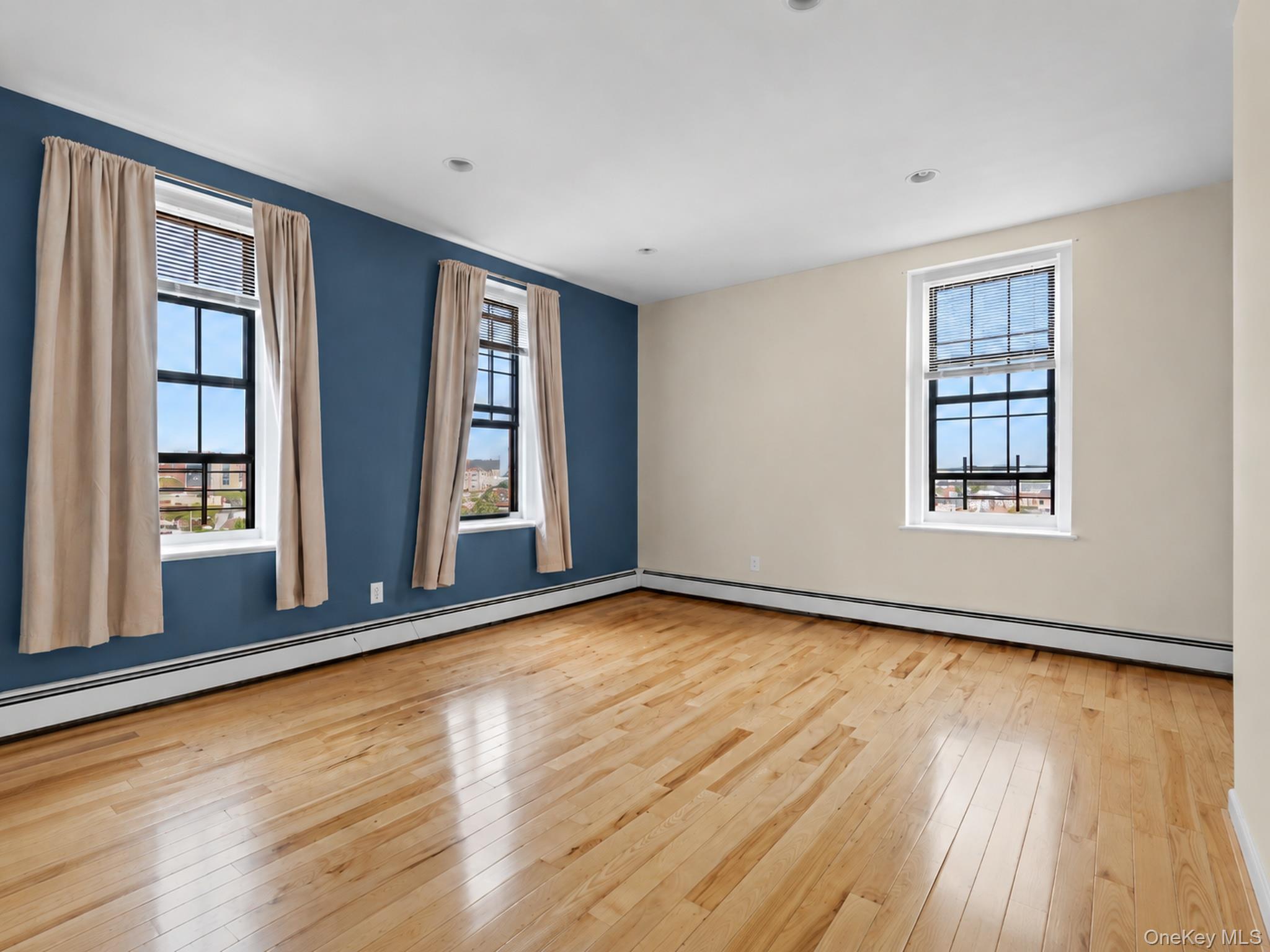 310 Riverside Boulevard, Unit 5F Long Beach, NY 11561 - Photo 17 of 23 Large Bedroom with West and North Exposure....