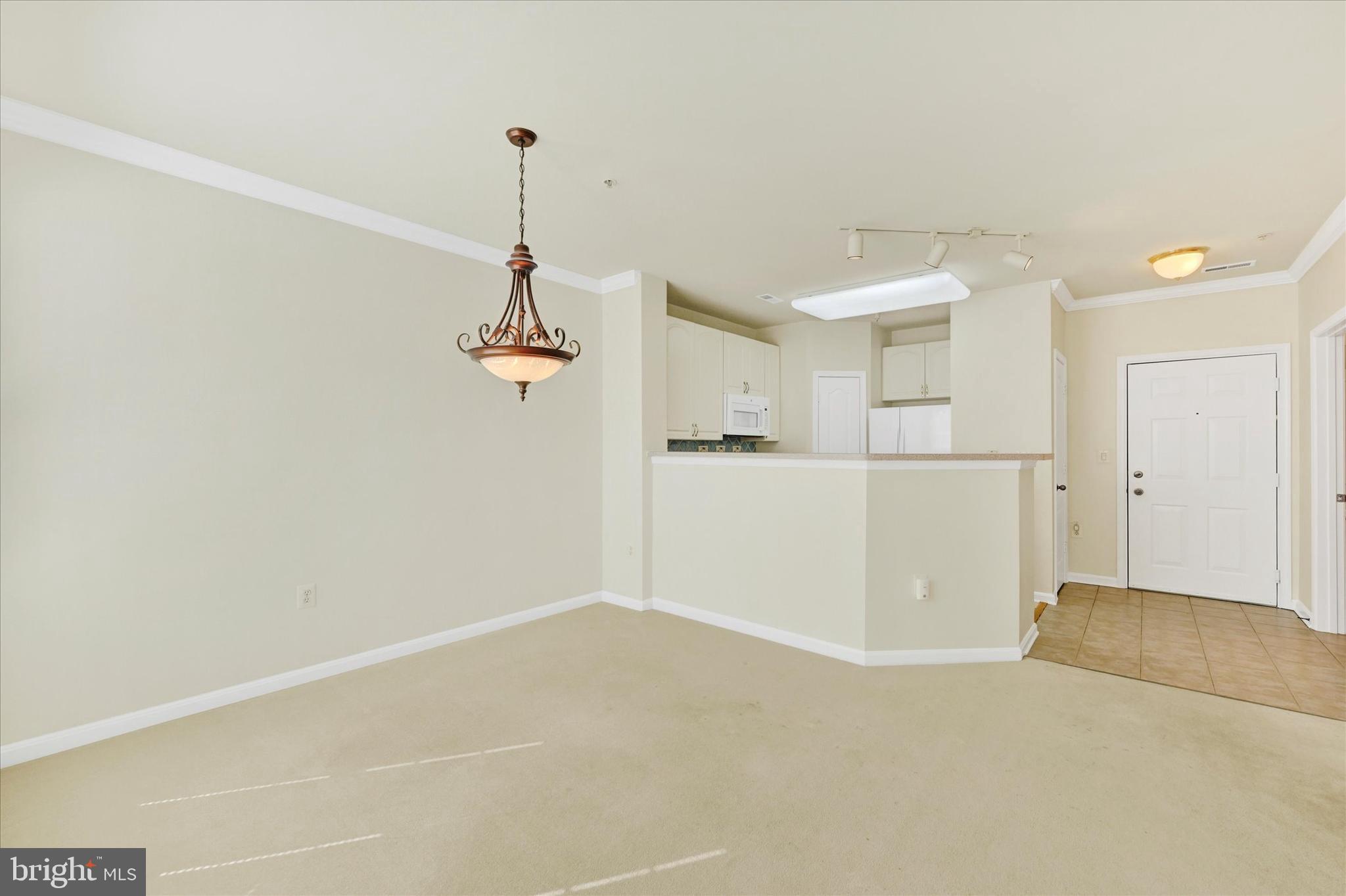 400 Symphony Circle, Unit 414 Hunt Valley, MD 21030 - Photo 11 of 29 a view of a room with wooden floor and window