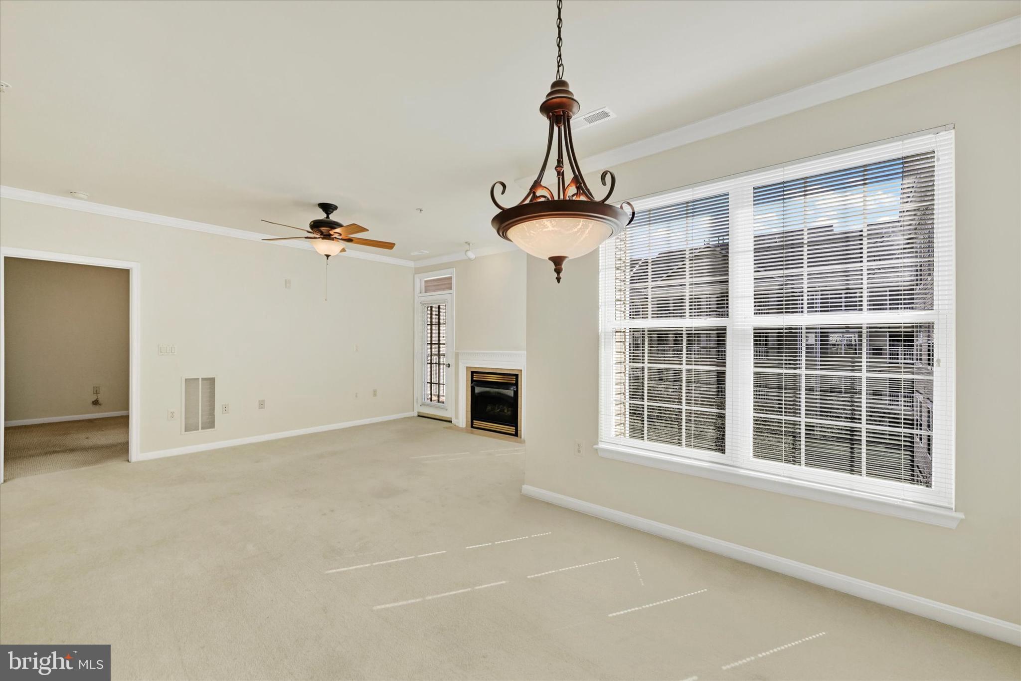 400 Symphony Circle, Unit 414 Hunt Valley, MD 21030 - Photo 12 of 29 a view of empty room with a ceiling fan