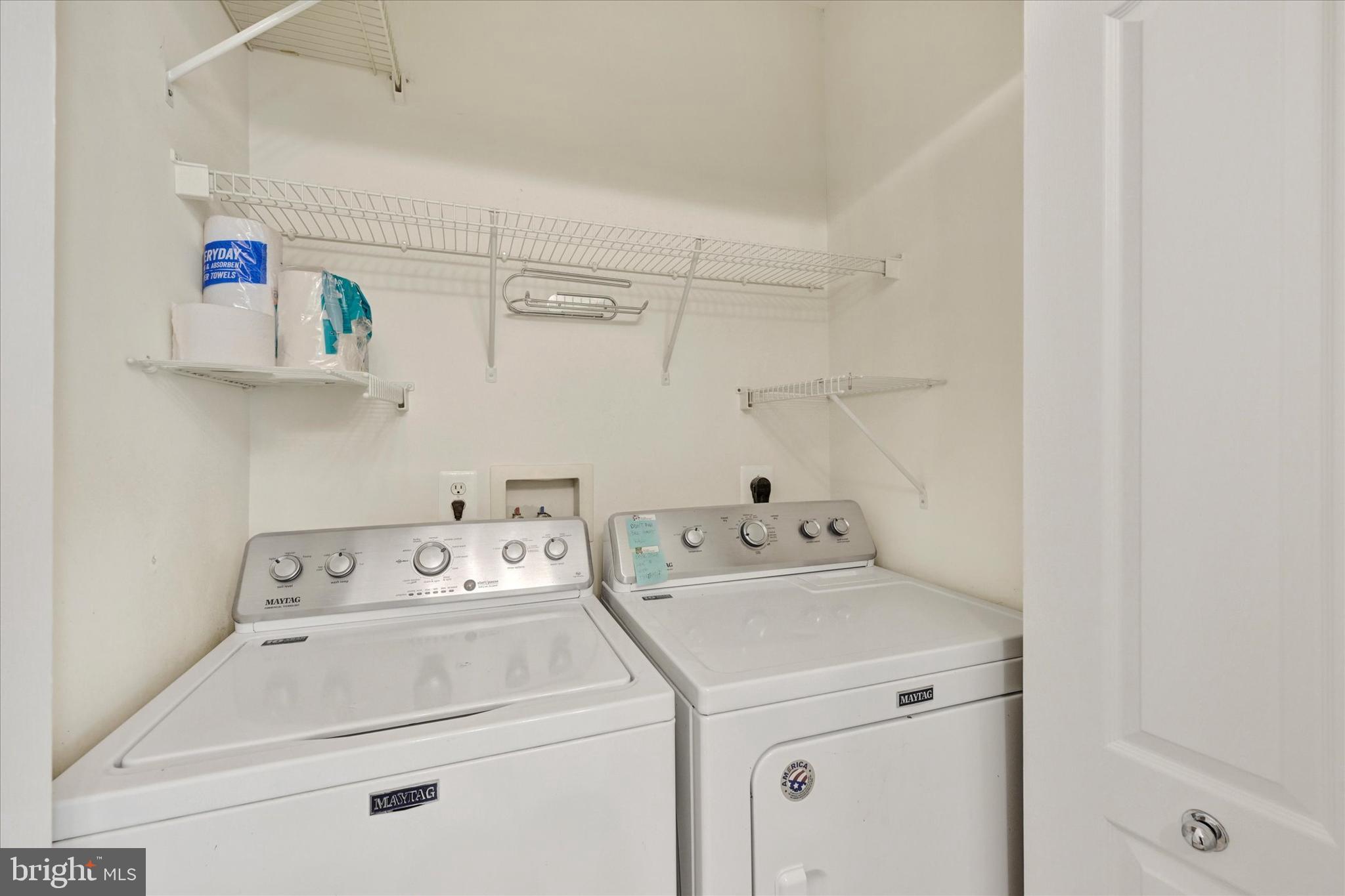 400 Symphony Circle, Unit 414 Hunt Valley, MD 21030 - Photo 19 of 29 a utility room with dryer and washer