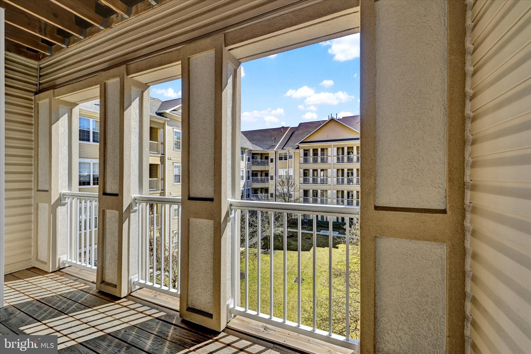 400 Symphony Circle, Unit 414 Hunt Valley, MD 21030 - Photo 20 of 29 a view of a balcony with wooden floor