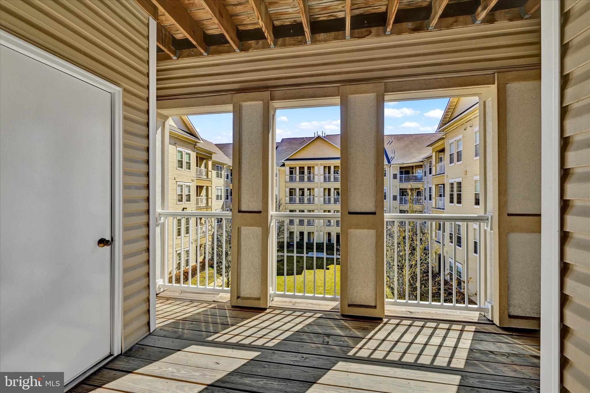 400 Symphony Circle, Unit 414 Hunt Valley, MD 21030 - Photo 21 of 29 a view of a brick house with large windows