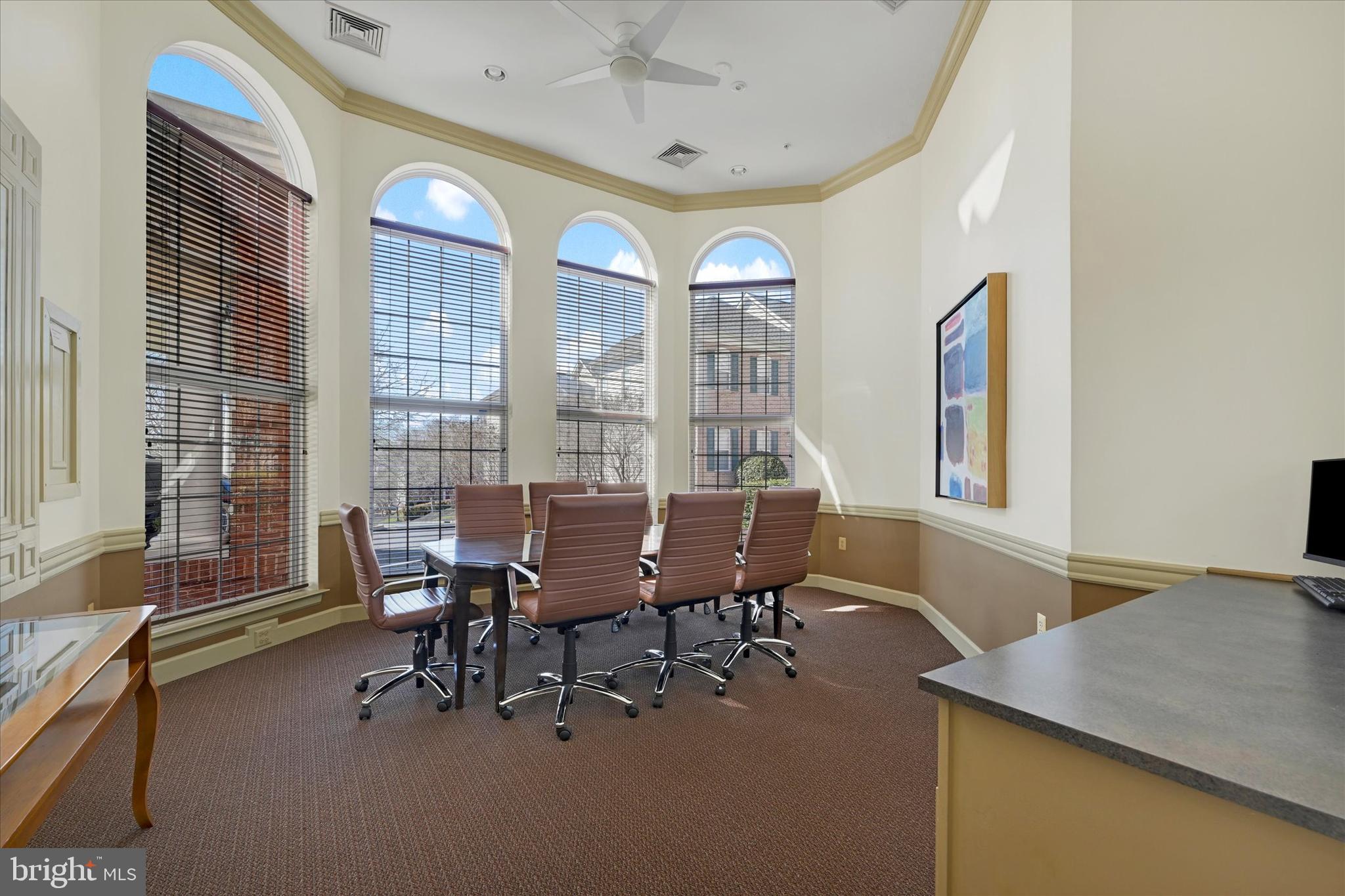 400 Symphony Circle, Unit 414 Hunt Valley, MD 21030 - Photo 22 of 29 a view of a dining room with furniture and a window