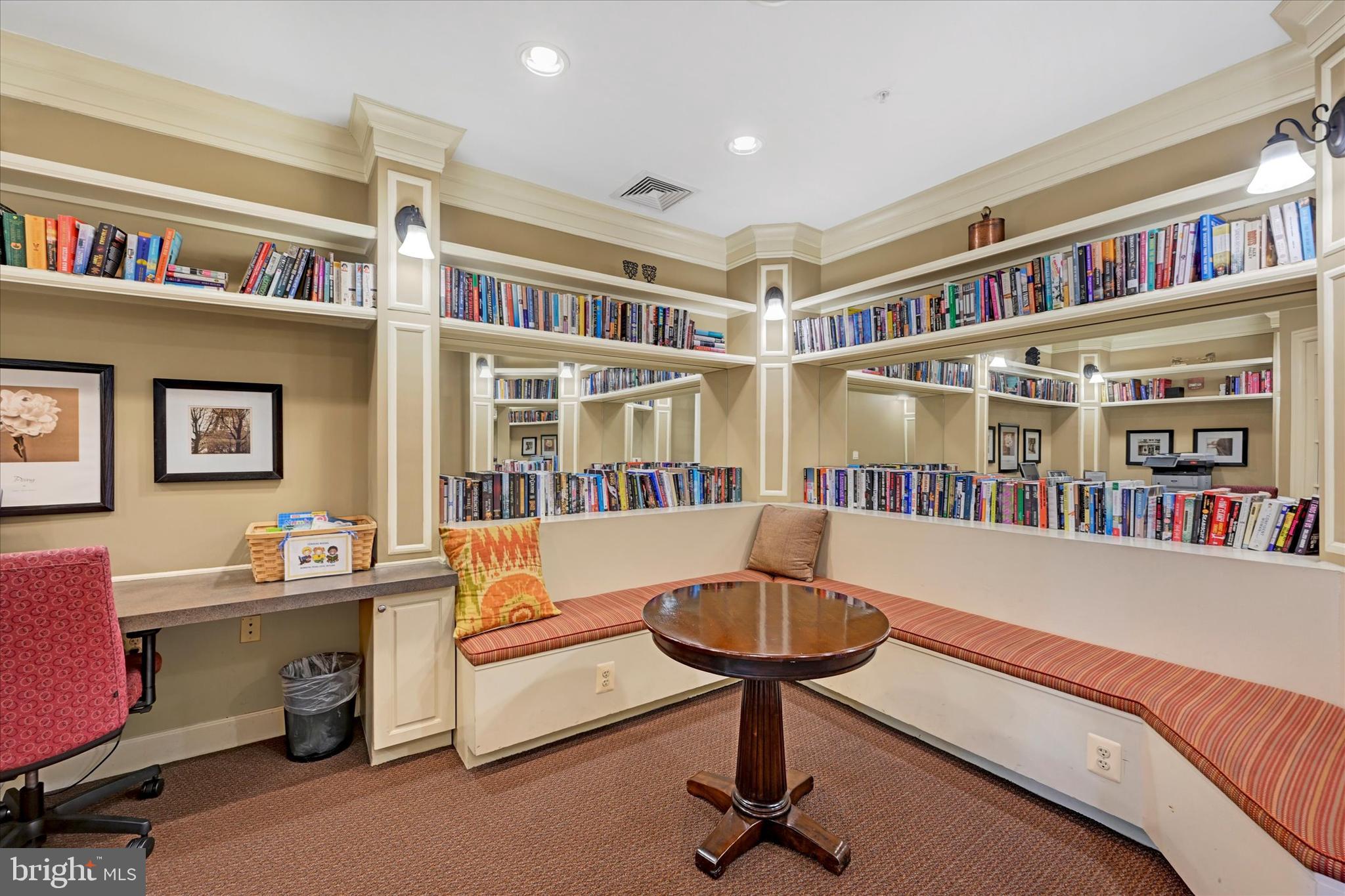 400 Symphony Circle, Unit 414 Hunt Valley, MD 21030 - Photo 23 of 29 a living room with furniture and a book shelf