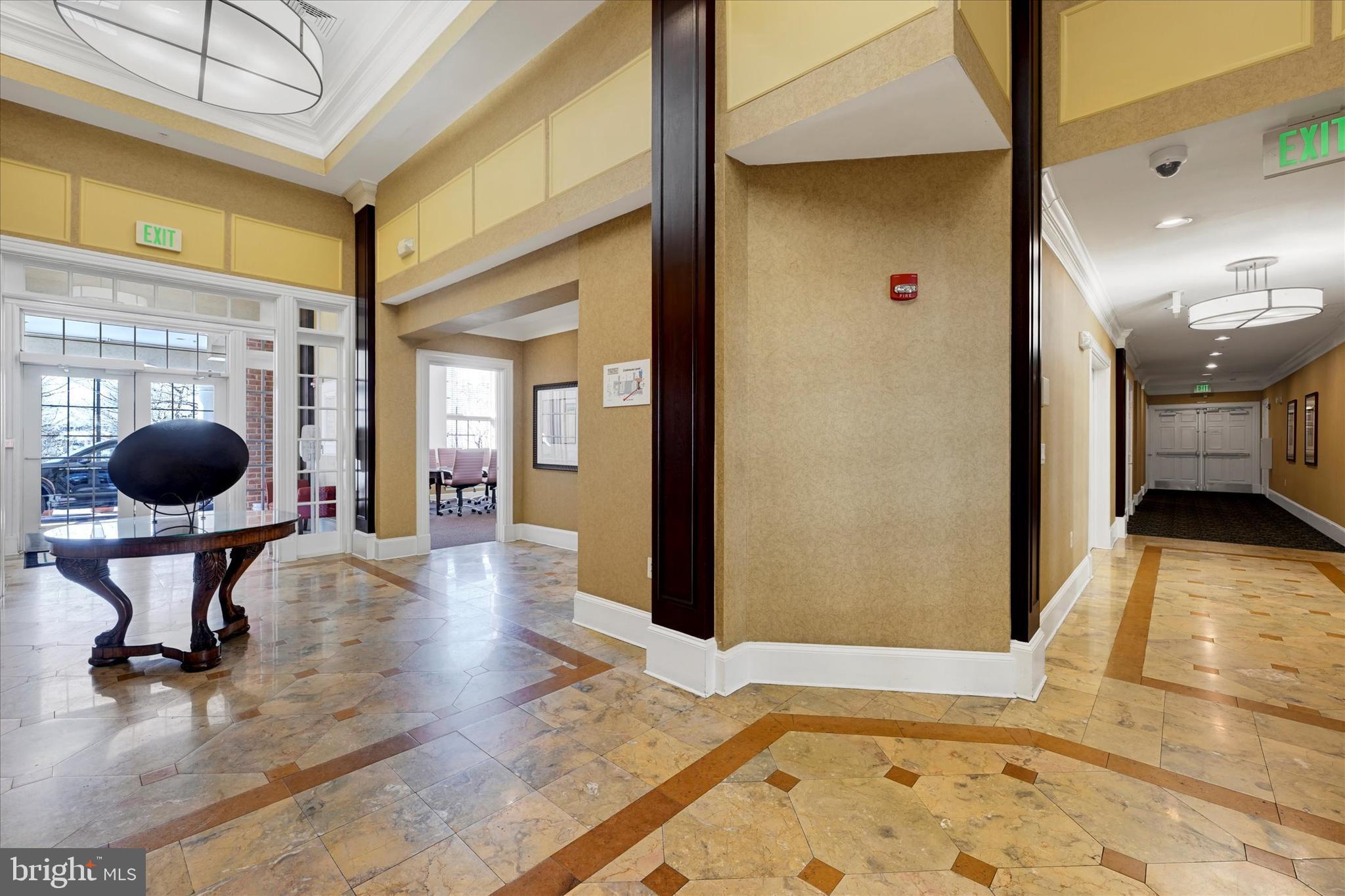 400 Symphony Circle, Unit 414 Hunt Valley, MD 21030 - Photo 24 of 29 a living room with furniture and a large mirror