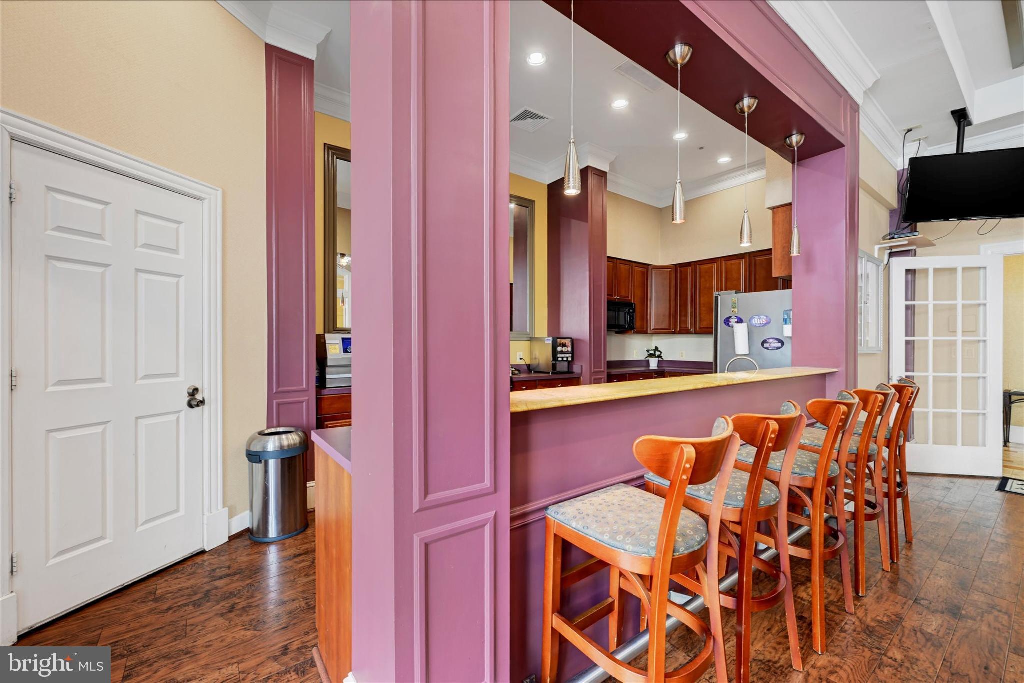 400 Symphony Circle, Unit 414 Hunt Valley, MD 21030 - Photo 25 of 29 a dining hall with stainless steel appliances a sink and chandelier