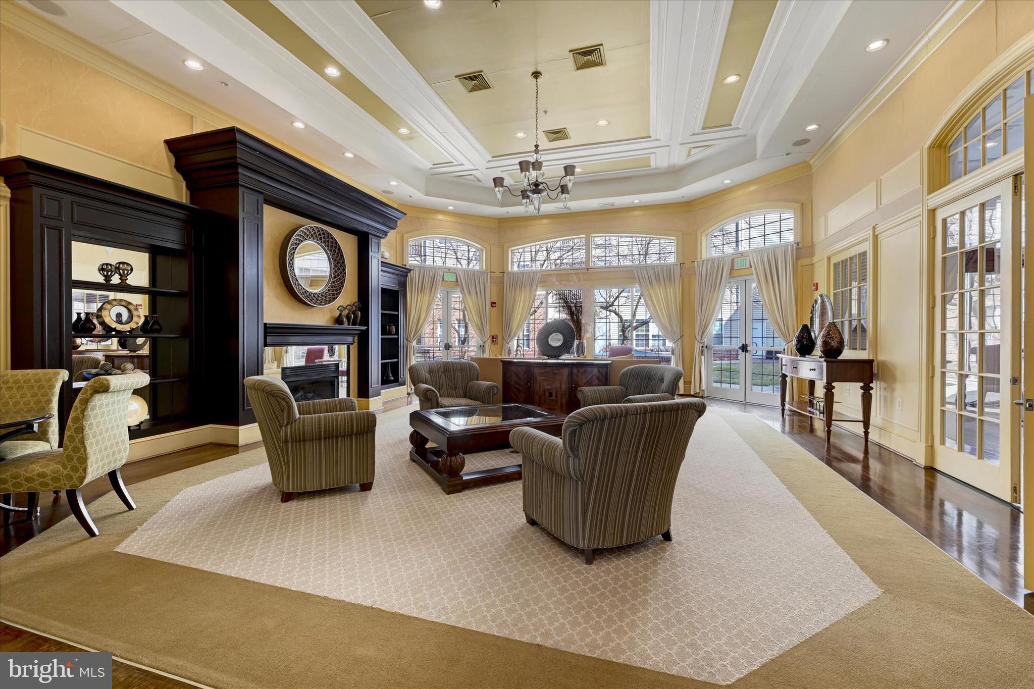 400 Symphony Circle, Unit 414 Hunt Valley, MD 21030 - Photo 27 of 29 a living room with fireplace furniture and a large window