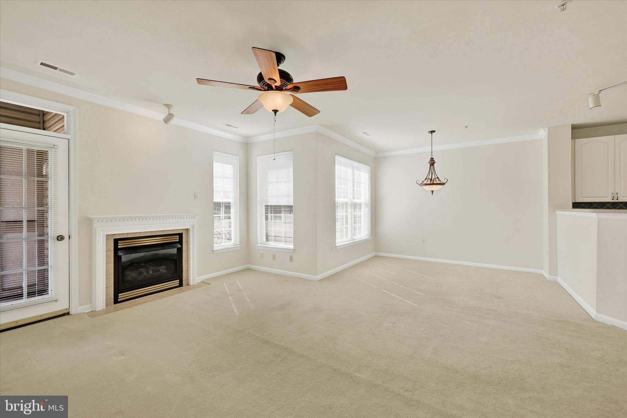 400 Symphony Circle, Unit 414 Hunt Valley, MD 21030 - Photo 9 of 29 a view of livingroom and fireplace with window