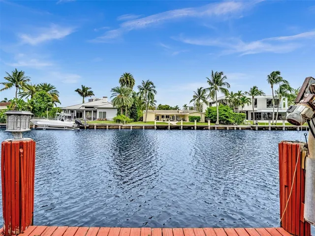 a living room with a table and a large window