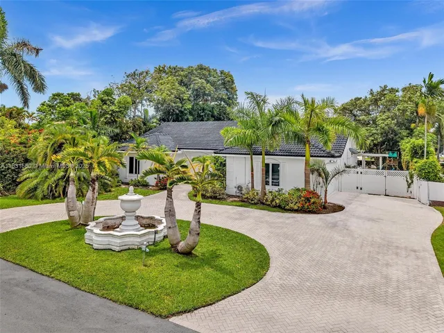 a view of a house with a garden