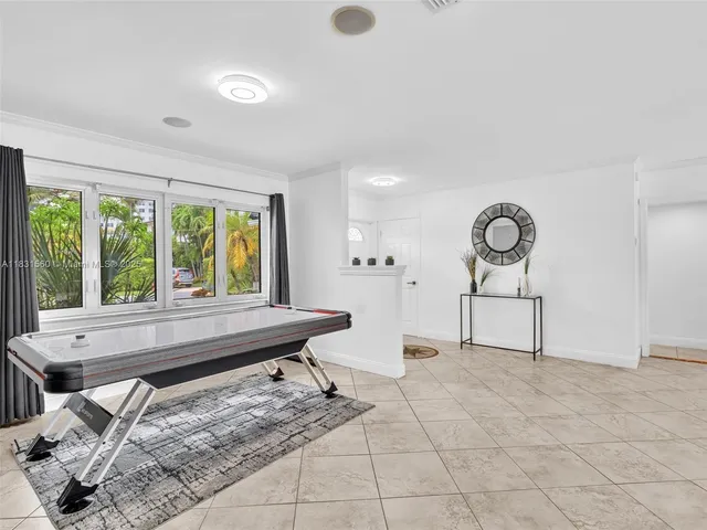 a view of a livingroom with wooden floor and cabinet