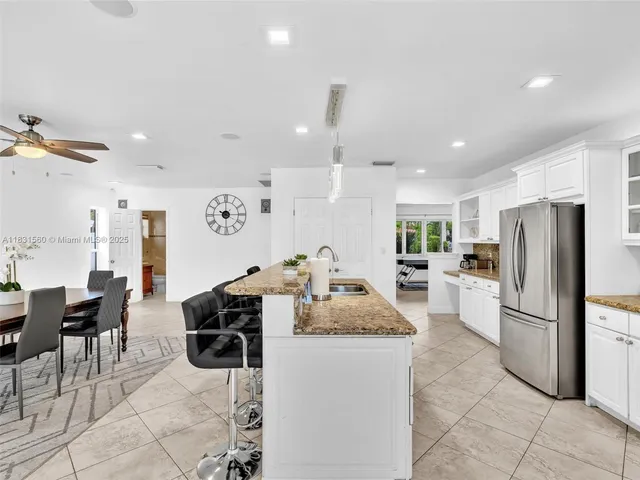 a bathroom with a sink toilet and a mirror