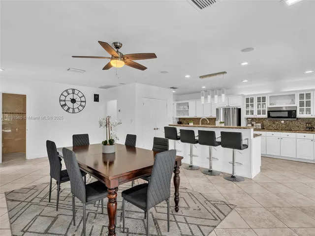 a bedroom with a bed and a night stand