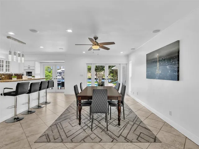 a view of a livingroom with wooden floor and a flat screen tv