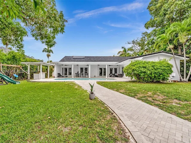 a view of a patio with a table chairs and a patio