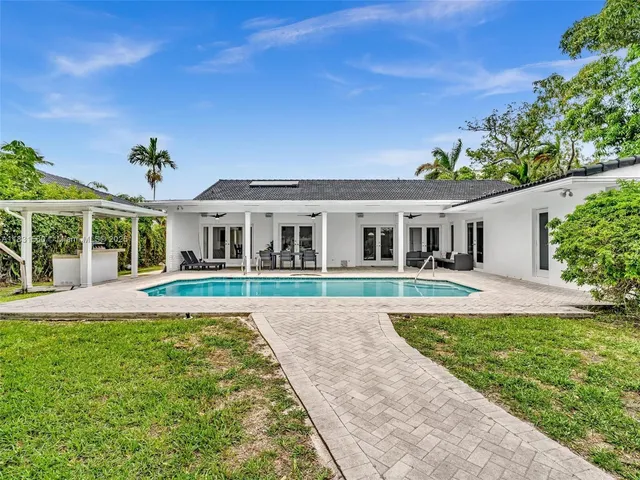a view of a patio with a table chairs and a patio