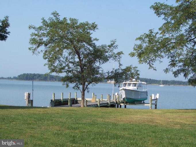 6796 Bozman Neavitt Road Bozman, MD 21612 - Photo 2 of 20 Dock with boat lift and boat well