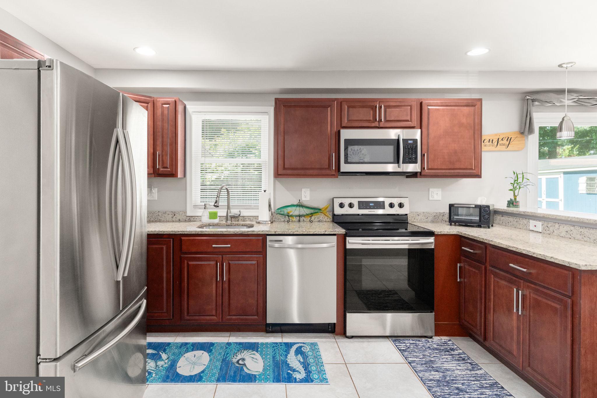 814 Foxwell Road Joppa, MD 21085 - Photo 5 of 21 a kitchen with stainless steel appliances granite countertop a refrigerator stove and sink