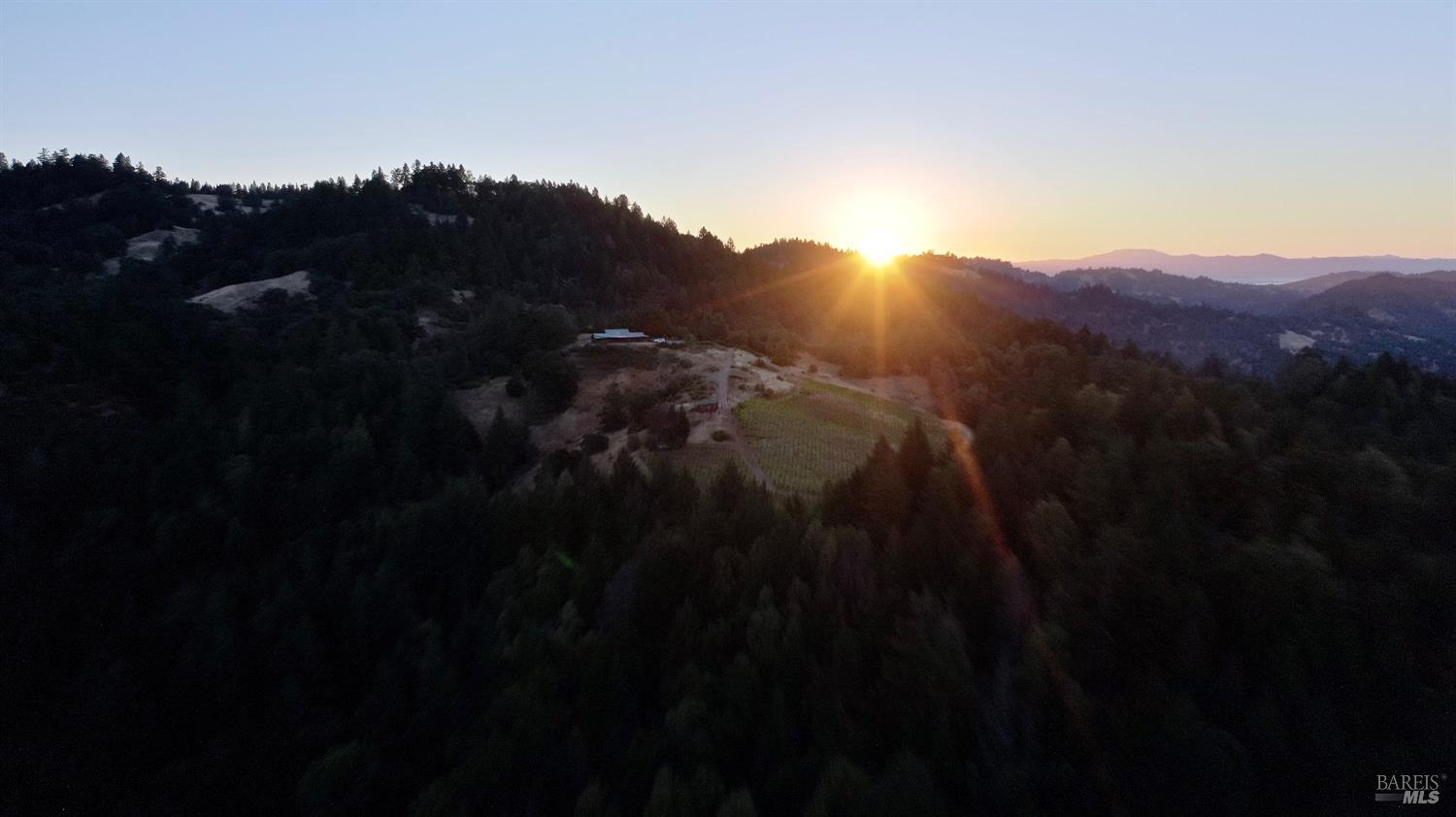 a view of sunset and a city