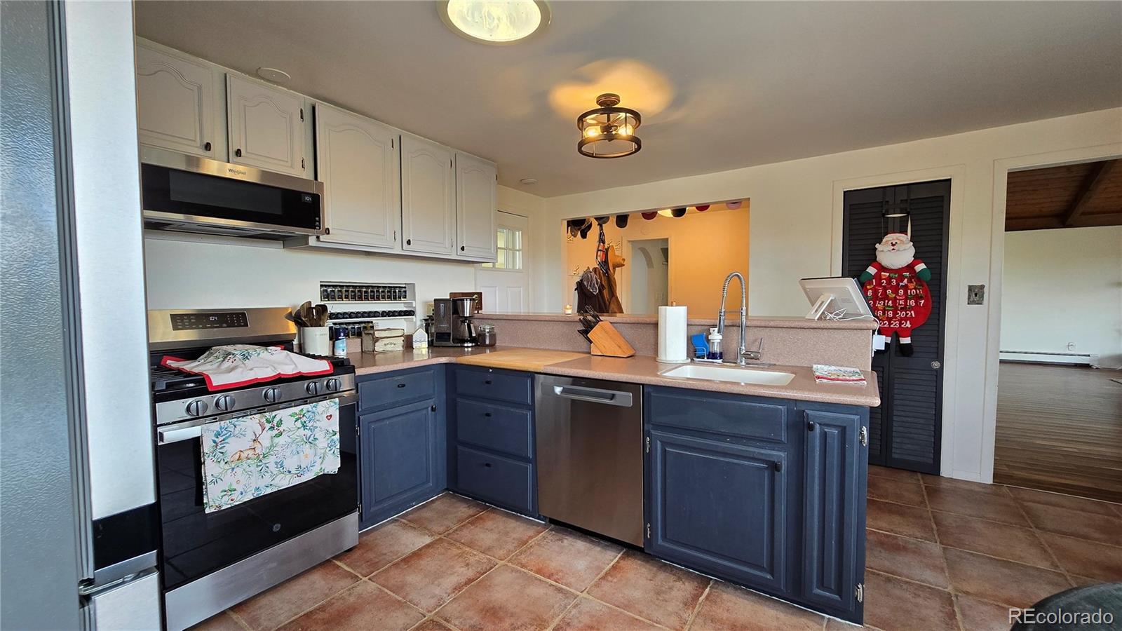 411 Gruenberg Road Fort Garland, CO 81133 - Photo 13 of 41 a kitchen with stainless steel appliances granite countertop a sink and cabinets